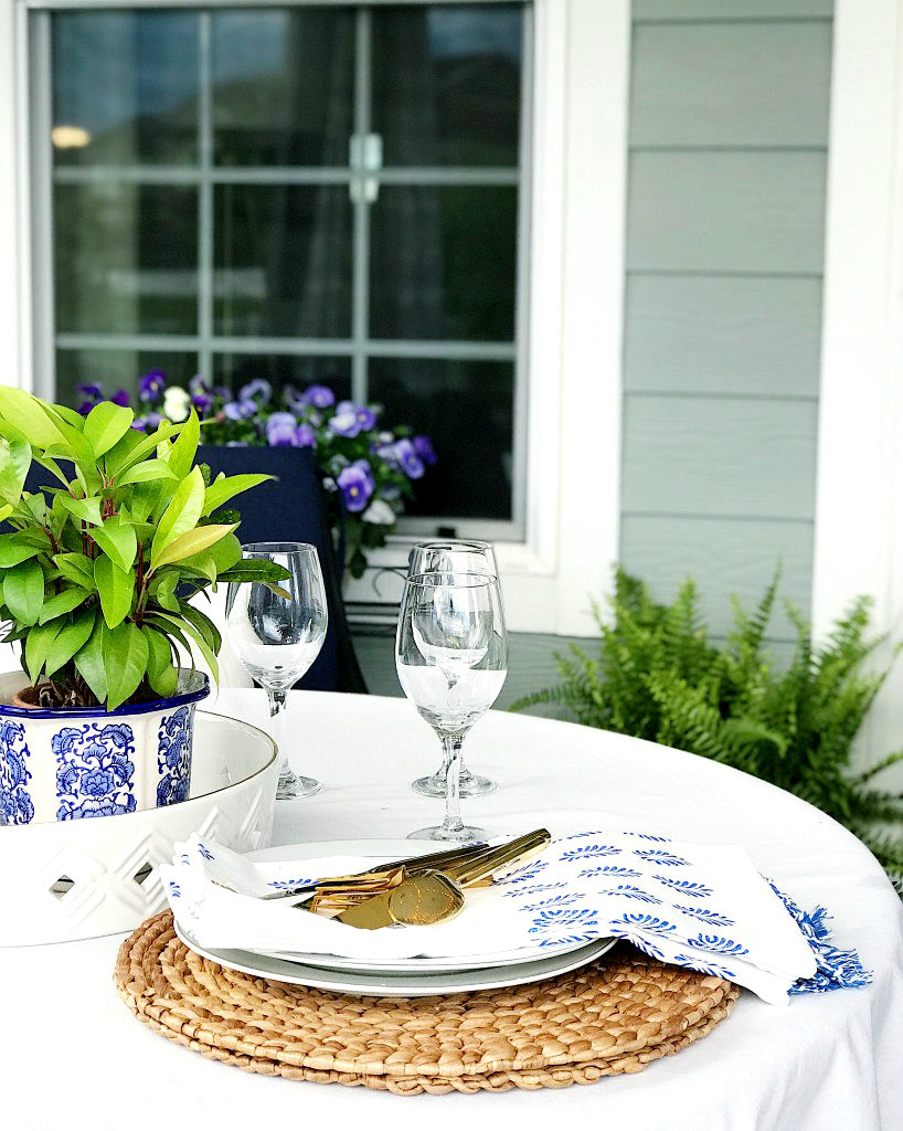 Our covered patio is our backyard oasis, the perfect summer place to retreat and relax! - jane at home - patio ideas - patio decor - patio furniture - backyard retreat - covered porch ideas - blue and white patio
